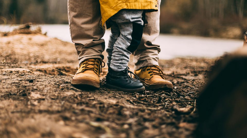 Parent and child in raincoat