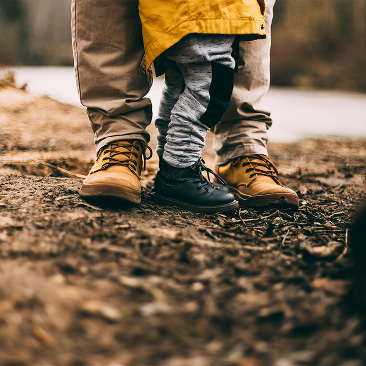 Parent and child in raincoat