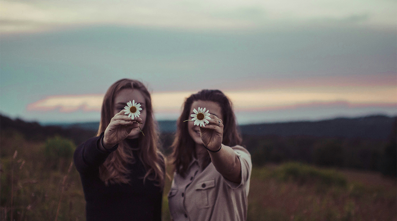 Women holding flowers