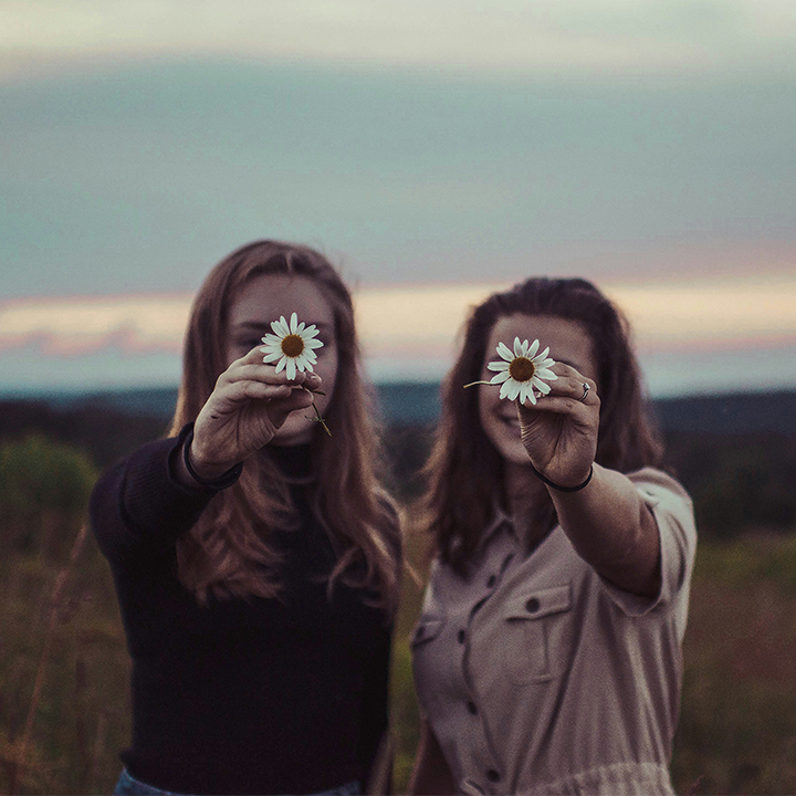 Women holding flowers