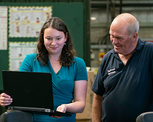 Engineers looking at computer